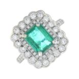 An emerald and diamond ring.