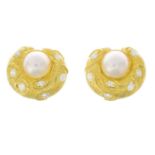 A pair of mabe pearl diamond earrings.