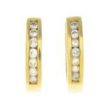 A pair of 18ct gold diamond earrings.