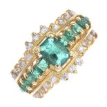 A 14ct gold emerald and diamond ring.