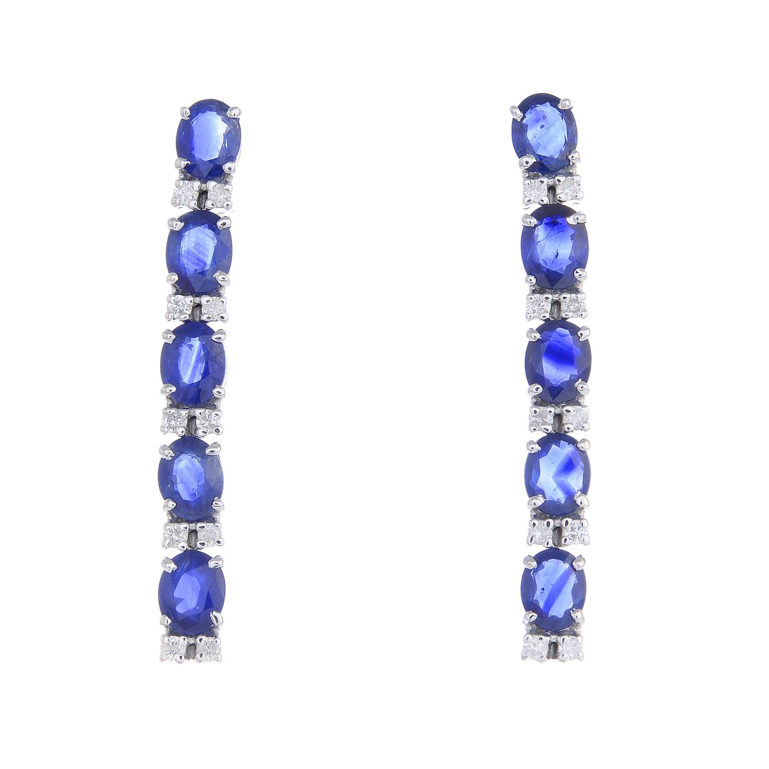 A pair of sapphire and diamond earrings.