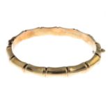 A 1970s 9ct gold bangle.