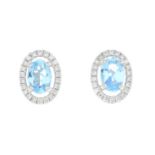 A pair of 18ct gold aquamarine and diamond earrings.