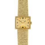 BUCHERER - a lady's 18ct gold watch.
