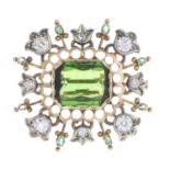 A tourmaline, diamond and emerald brooch.