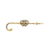 An early 20th century gold split pearl brooch.