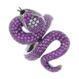 A gold sapphire and diamond snake ring.