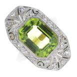 A peridot and diamond dress ring.