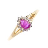 A 9ct gold ruby and diamond cluster ring.