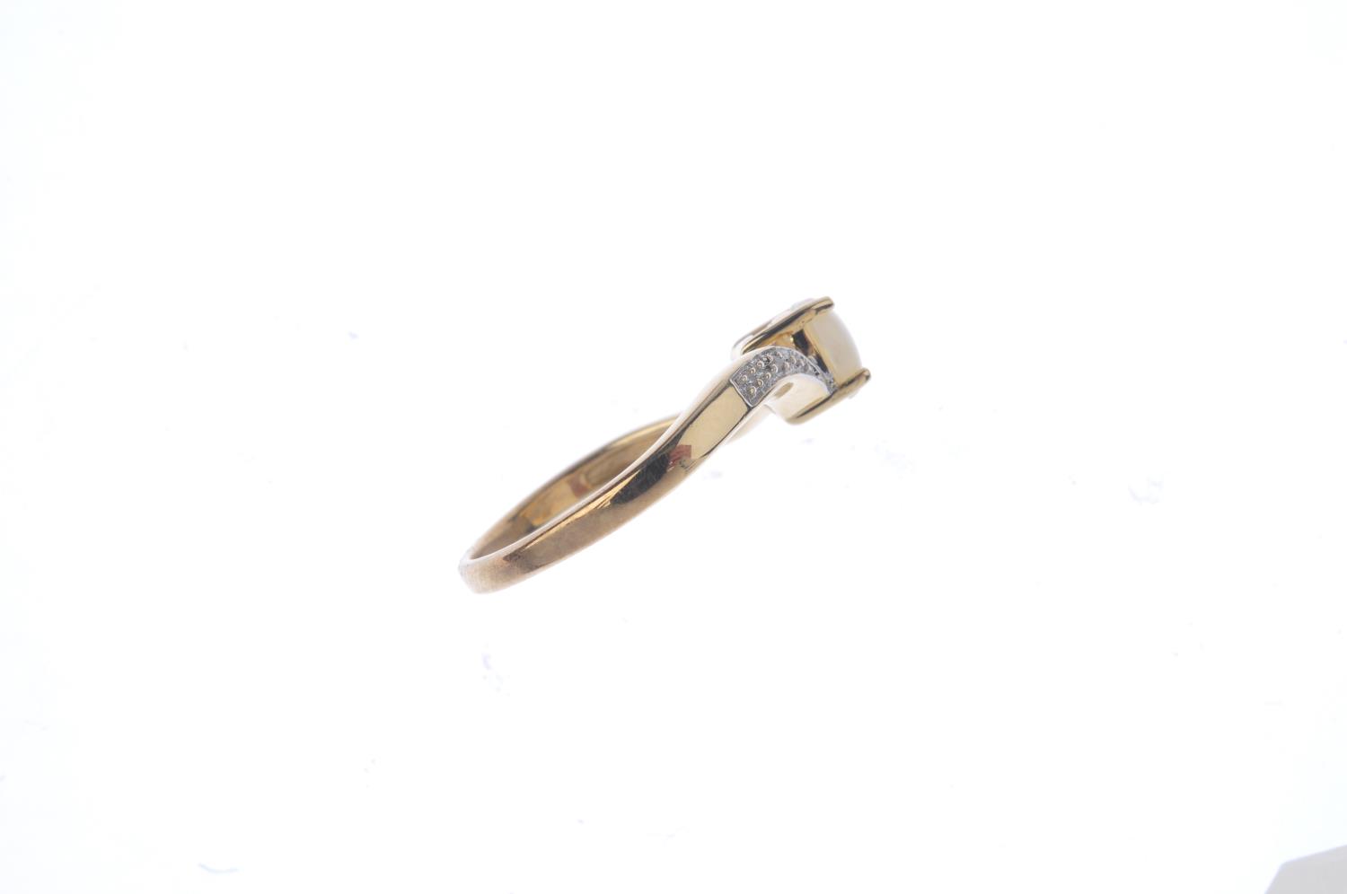 A 9ct gold opal and diamond crossover ring. - Image 2 of 3