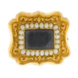 An early 19th century gold split pearl memorial brooch.