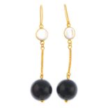 A pair of moonstone and onyx earrings.