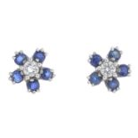 A pair of sapphire and diamond stud earrings.