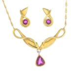 An 18ct gold ruby necklace and earrings.