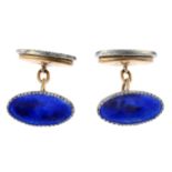 A pair of enamel cufflinks.