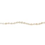 A natural pearl single-strand bracelet.