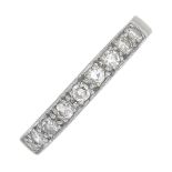 A mid 20th century 18ct gold and platinum diamond half eternity ring.