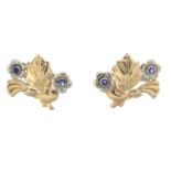 A pair of sapphire floral earrings.