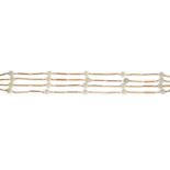 An 18ct gold cultured pearls multi-row bracelet.