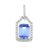 A sapphire and diamond cluster pendant.