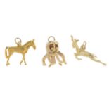 Three charms. To include a 9ct gold horse charm,