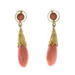 A pair of coral earrings.