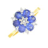 An 18ct gold sapphire and diamond cluster ring.