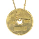 GUCCI - an 18ct gold pendant.