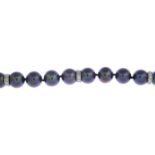 A dyed cultured pearl and diamond bracelet.