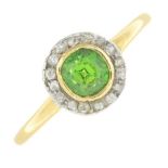 An early 20th century 18ct gold demantoid garnet and diamond cluster ring.