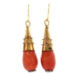 A pair of coral earrings.