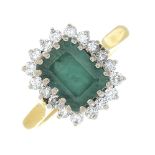 An 18ct gold emerald and diamond cluster ring.