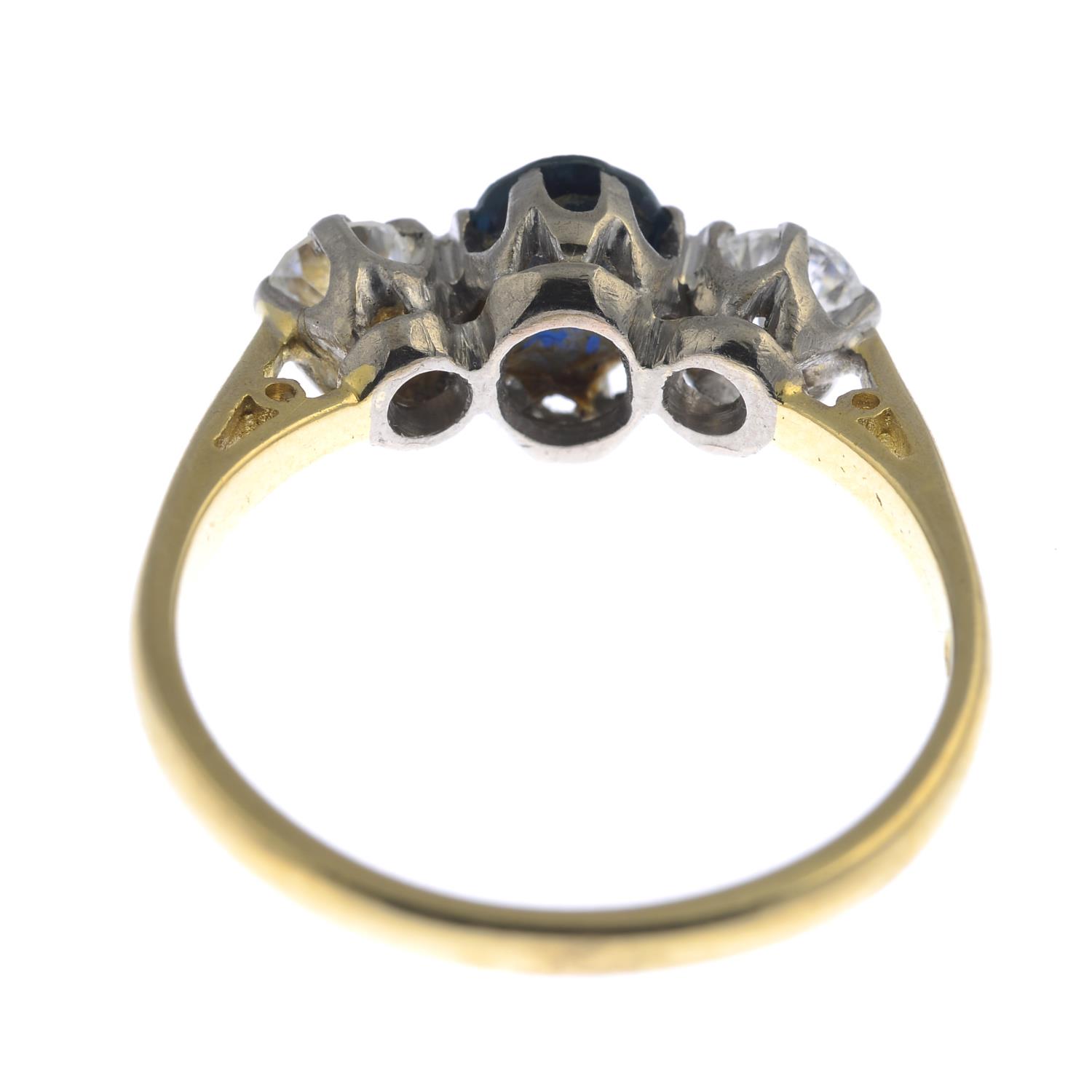 An 18ct gold diamond and sapphire three-stone ring. - Image 3 of 3