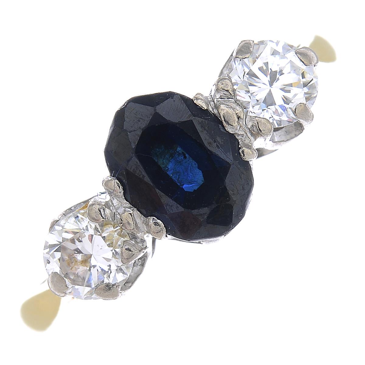 An 18ct gold diamond and sapphire three-stone ring.