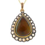 An opal and diamond pendant.