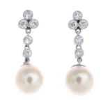 A pair of cultured pearl and diamond drop earrings.