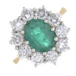 An 18ct gold emerald and diamond cluster ring.