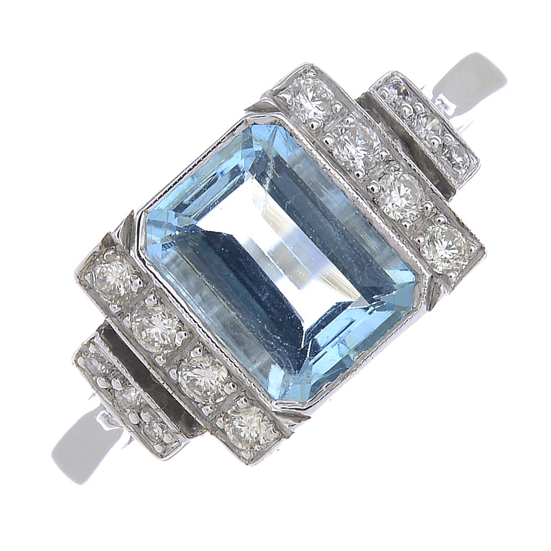 An aquamarine and diamond dress ring.