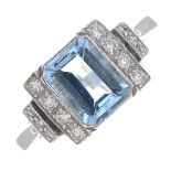 An aquamarine and diamond dress ring.