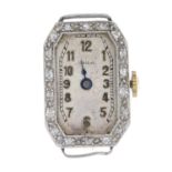 An early 20th century platinum diamond watch head.