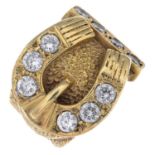 (64231) A 9ct gold gem-set buckle ring.