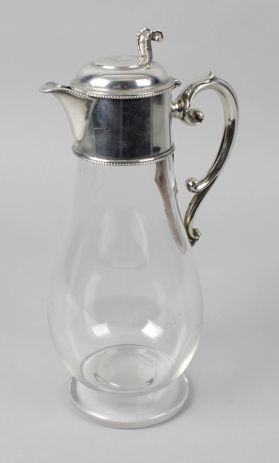 A Victorian silver mounted glass claret jug,