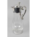 A Victorian silver mounted glass claret jug,