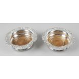 A pair of mid-twentieth century silver mounted coasters,