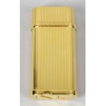 A Cartier gold plated cigarette lighter,