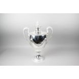 A George III silver large twin-handled trophy cup and cover,