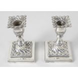 A pair of Victorian silver dwarf candlesticks,