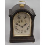 An early 20th century oak cased mantel clock,