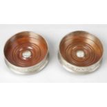 A pair of modern silver mounted bottle coasters,