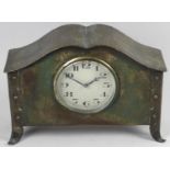 An Arts and Crafts oxidized metal cased clock,